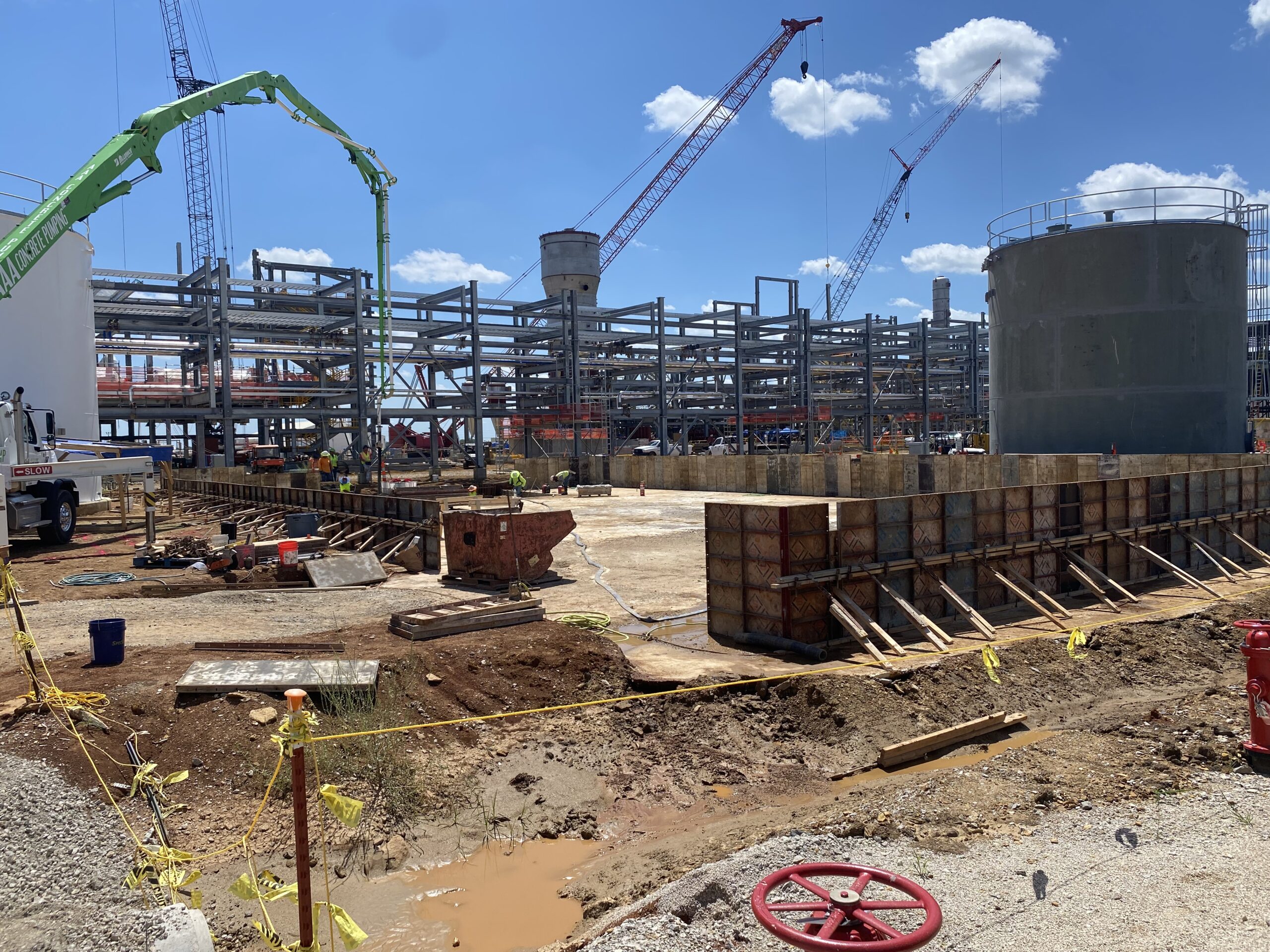 A construction site with a lot of construction equipment.