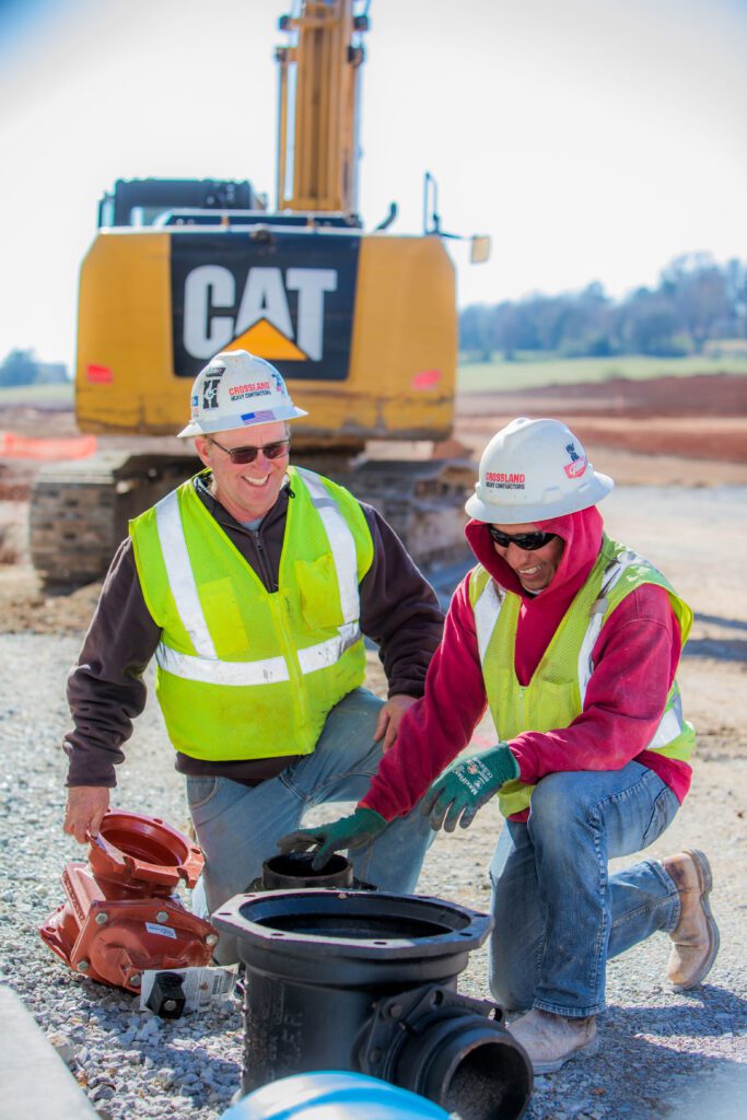 Two men working at a contruction site.