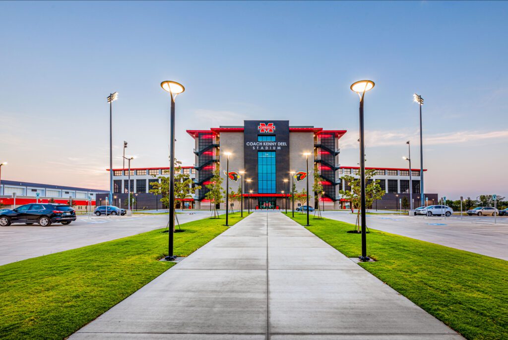 The entrance to a stadium at dusk.