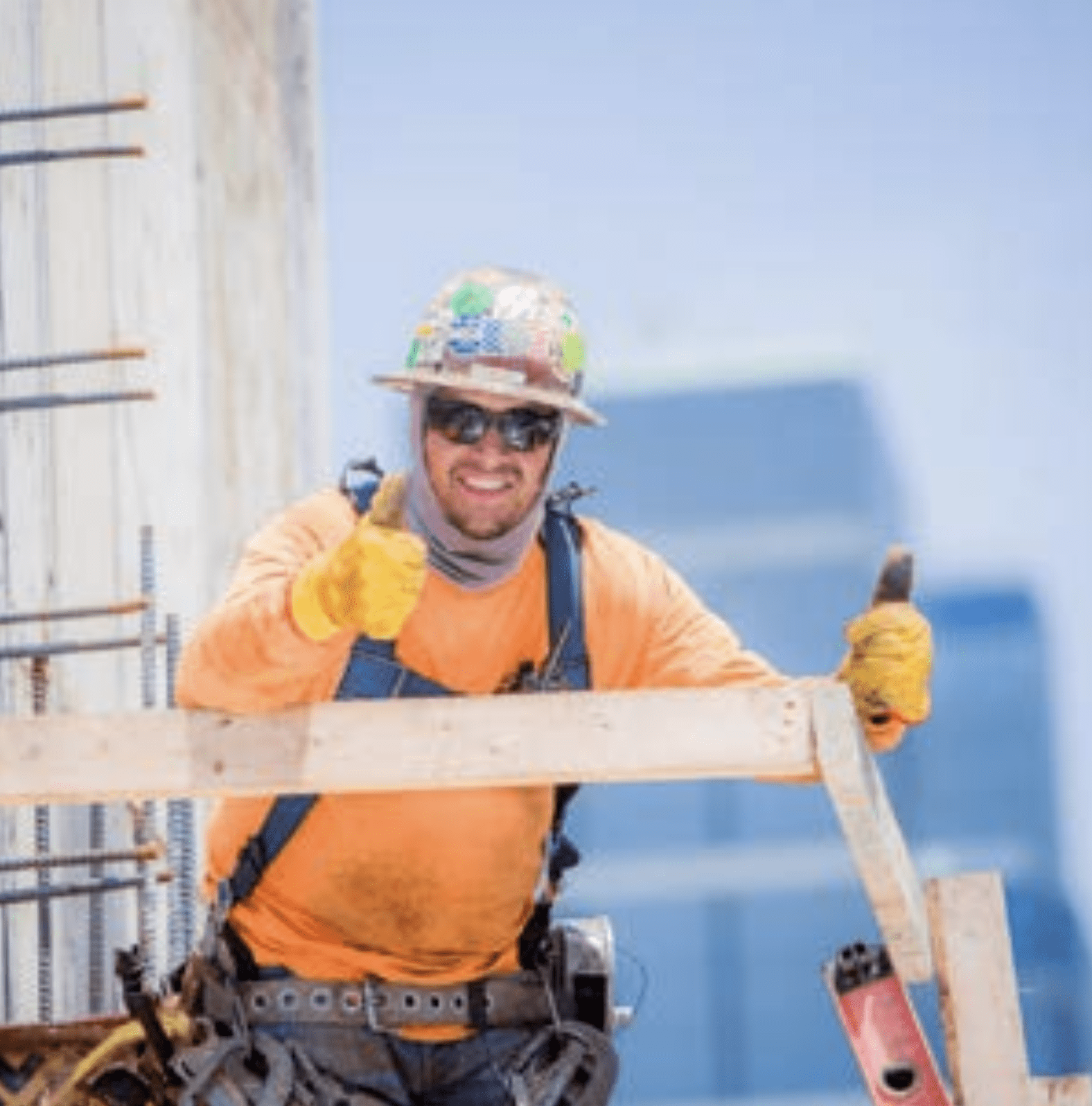 A construction worker giving a thumbs up.