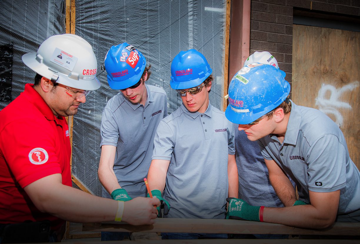 Apprentices learning a skill with their mentor.