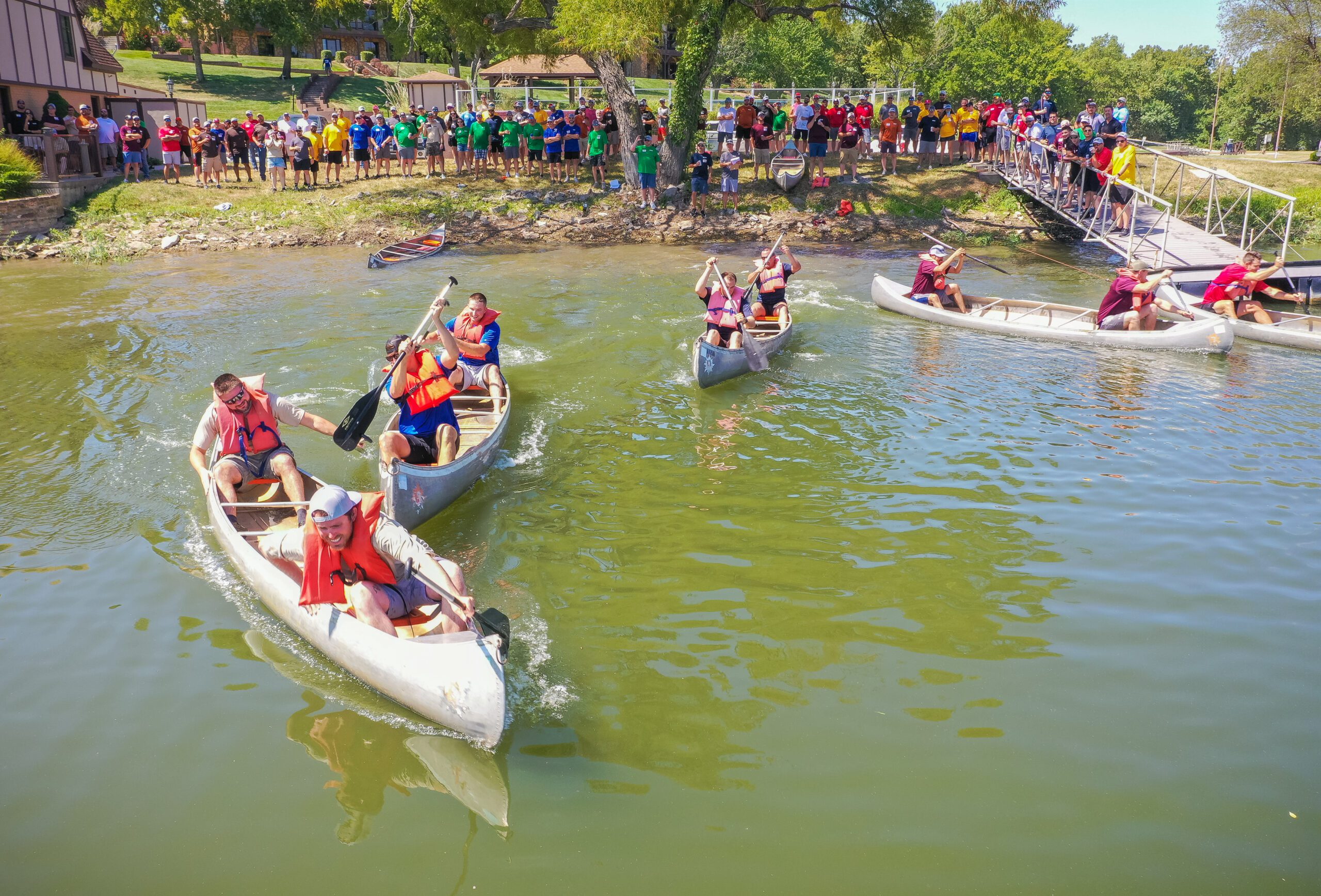 A group of people in canoes.