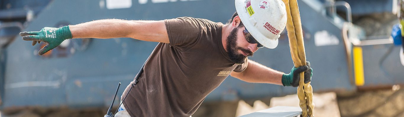 Crossland construction worker busy outside.