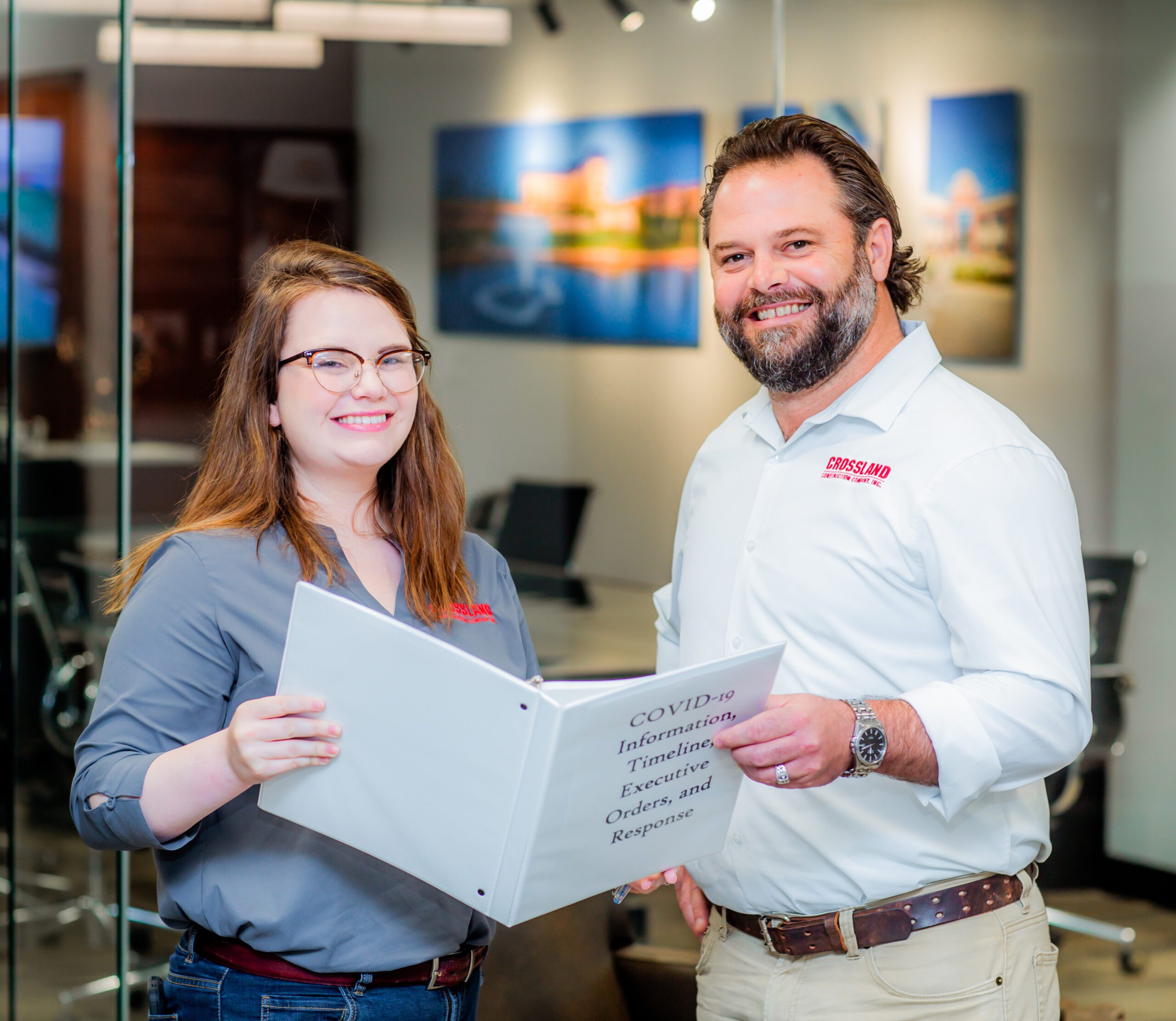 Two Crossland Construction employees smiling.