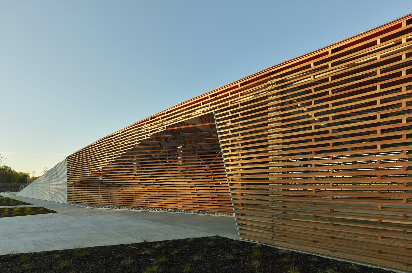 A modern building with wooden slats on the side.