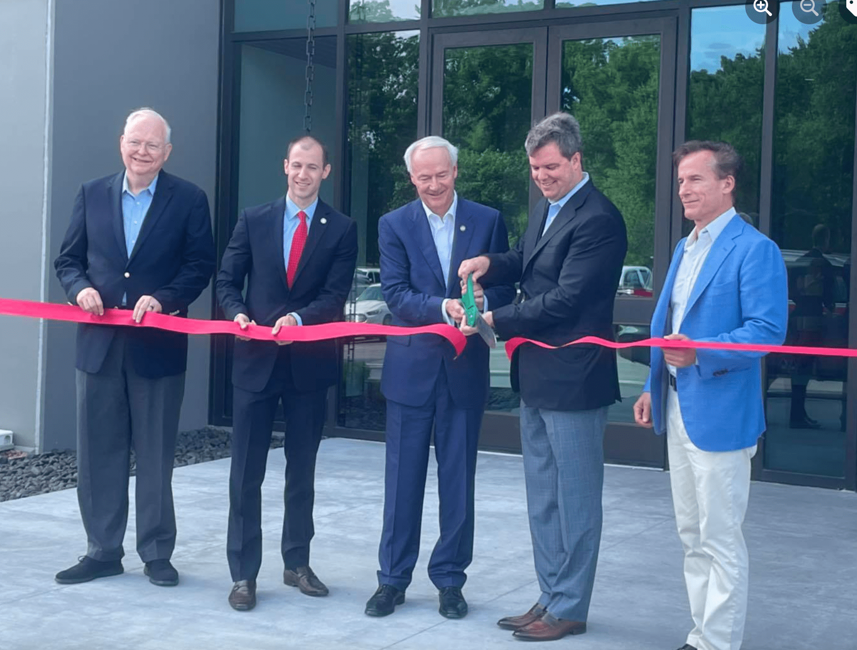 Five business men cutting ribbon to unveil the New Rogers Center.