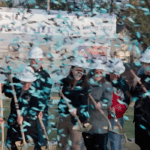 A group of people with shovels and confetti.