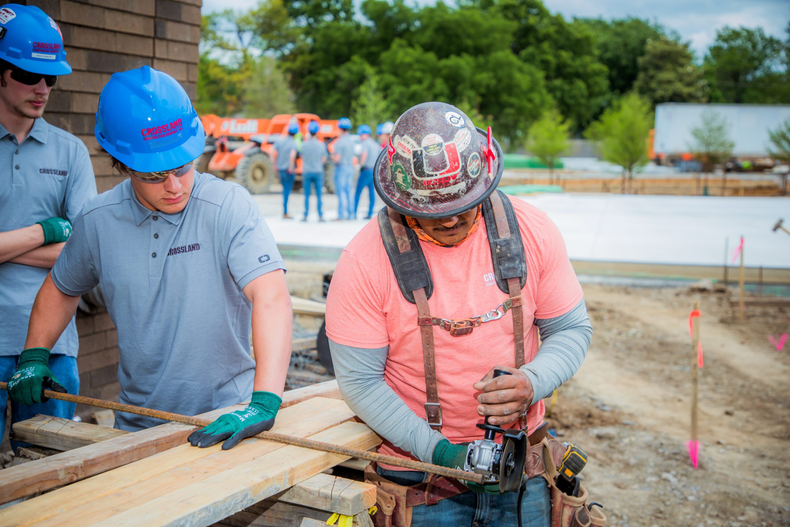 Crossland construction crew busy working outside on a job site.