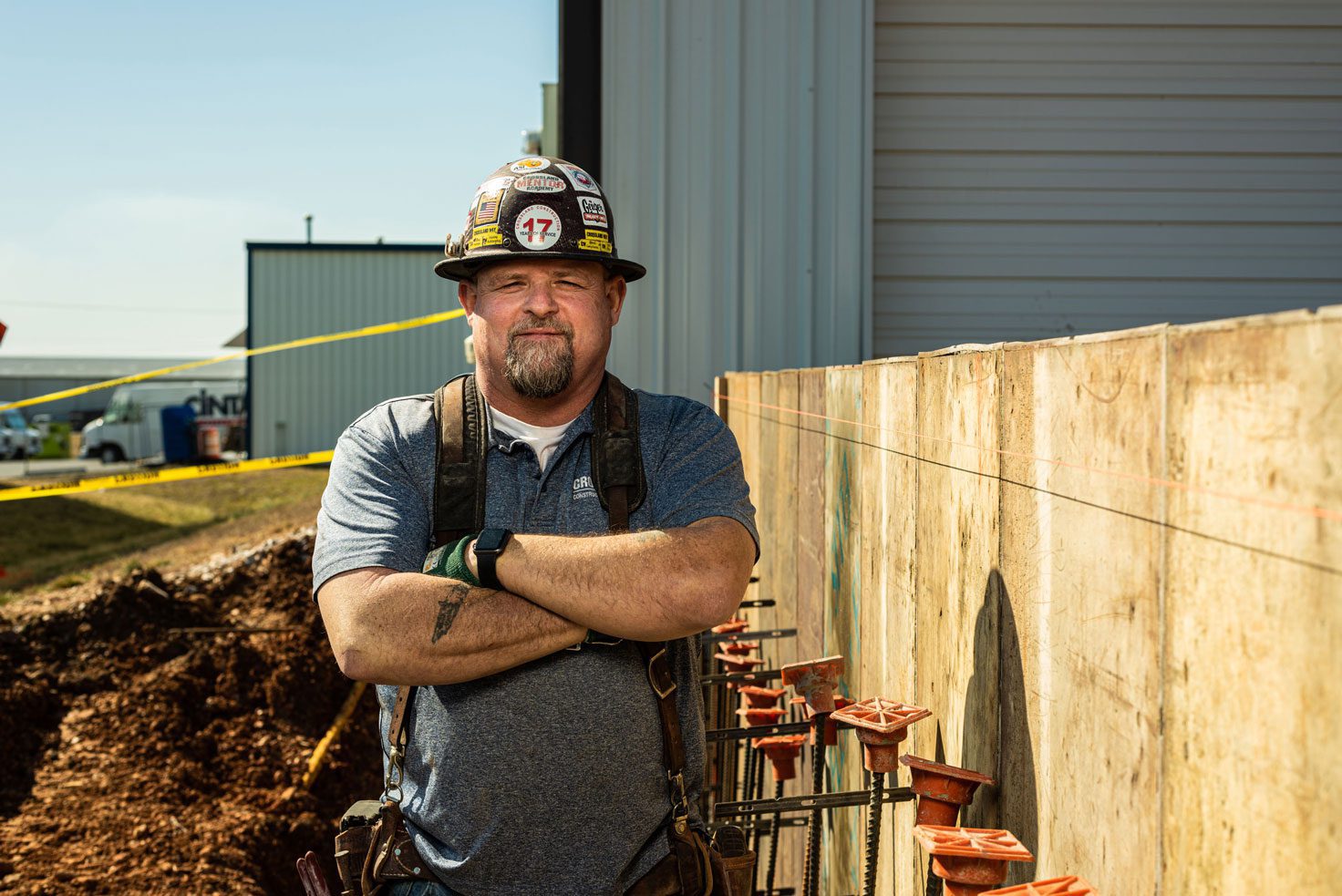 Crossland construction mentor standing outside on a job site.