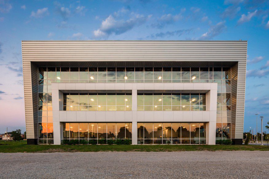 Exterior of a large building with many windows.